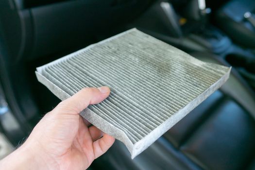 hand hold dirty car air conditioning filter 