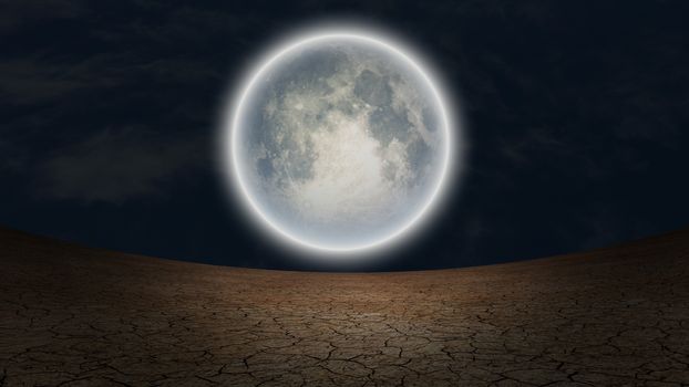 Surrealism. Full moon over arid land.