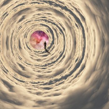 Man walking in cloudy space tunnel