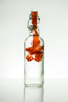 Bottle with red smoke and cap