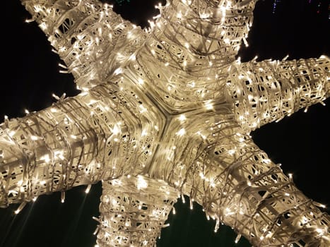 white pointy or spiky Christmas or holiday light star illuminated