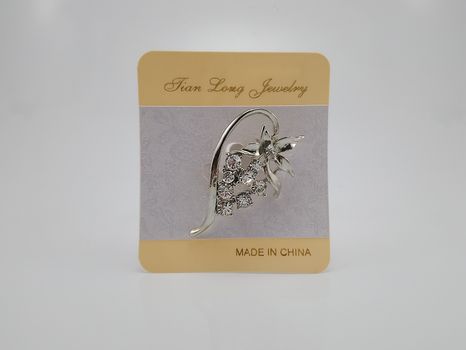 QUEZON CITY, PH - JULY 28 - Tian Long jewelry metal brooch pin on July 28, 2020 in Quezon City, Philippines.