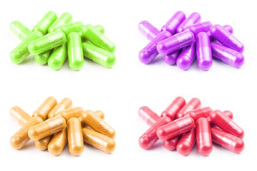 set of of colored organic capsules isolated on white background closeup with selective focus.