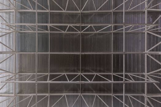 Industrial ceiling with profiled sheet and girder beam system flat zenith wide angle background.