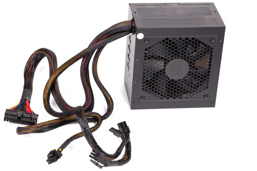 pc atx half-modular power supply isolated on white background with selective focus.
