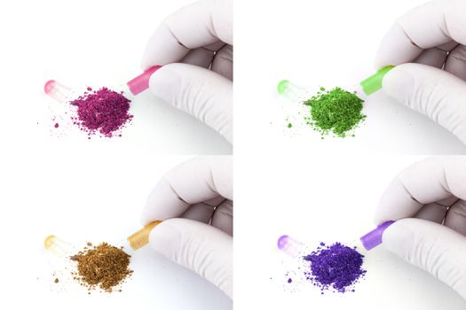 hand in medical glove opening colored organic med capsule isolated on white background closeup.