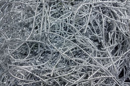 Long curly aluminium chips pattern background with selective focus.