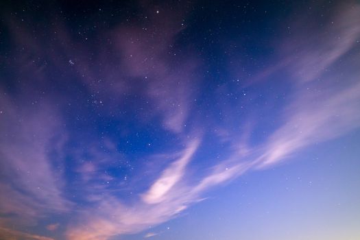 natural starry sky and motion blurred clouds background without montage.