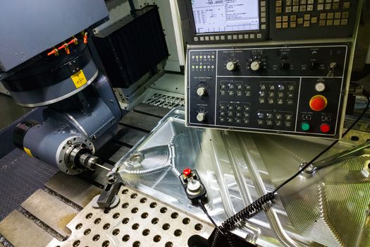 Measuring process with ruby touch probe on large CNC milling machine in jog mode.