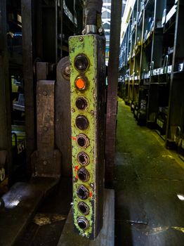 long green metal industrial lift pedent control box.
