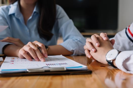 Close up Business people meeting to discuss the situation on the market. Business Financial Concept.