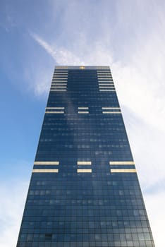 Skyscrapers against blue sky and clouds angle shot