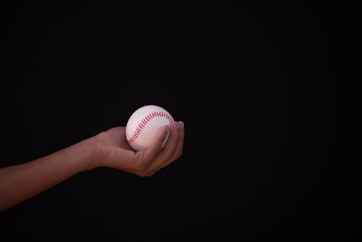 Baseball in hand of individual with copy space