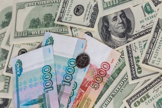 us dollars and russian rubles close-up background with selective focus.