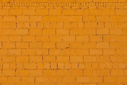 orange plaster rough brick wall texture under direct sunlight