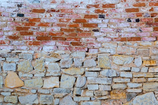 mixed used bricks and stone flat wall texture.