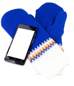 blue and white knited mittens with cellphone isolated on white background.