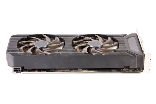 Used and dusty black PC video card isolated on white background.