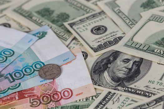 us dollars and russian rubles close-up background with selective focus.