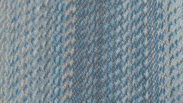 Extreme close up blue woolen fabric in woven pattern. Texture, textile background. Macro shooting