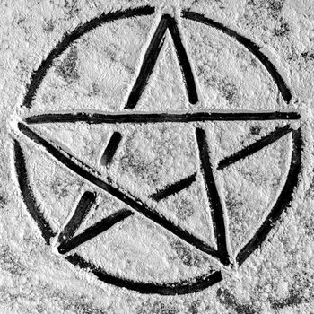 Old steel Pentagram closeup photo on background