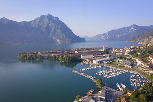 Aerial view of Lake Iseo at sunrise, on the right the port of lovere,background mountains(alps), Bergamo Italy.