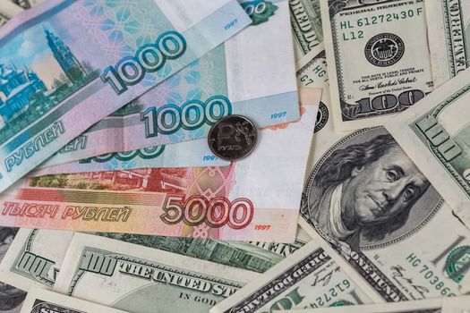 us dollars and russian rubles close-up background with selective focus.