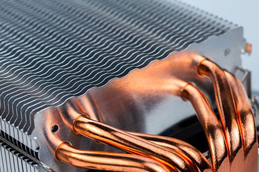 modern tower heat radiator with six copper heatpipes closeup macro background with selective focus, blur and diagonal composition