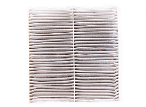 dirty car air conditioning filter isolated on white background