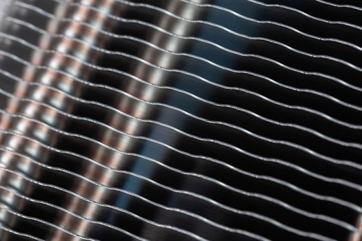 modern tower heat radiator closeup macro background with selective focus, blur and diagonal composition