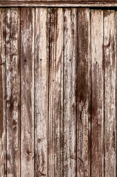 Weathered pink painted metal wall. Abstract background and rough texture.