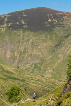 Retirement Image Of An Active Senior Man Hiking In the Scottish Countryside