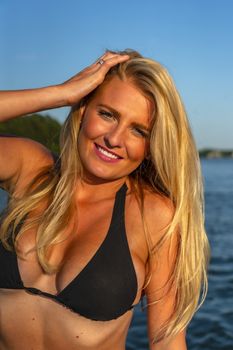 A gorgeous bikini model enjoying a day on the water