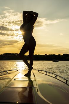 A gorgeous bikini model enjoying a day on the water