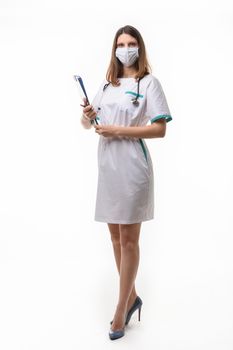 model in medical uniform with medical attributes and a tablet on a white background