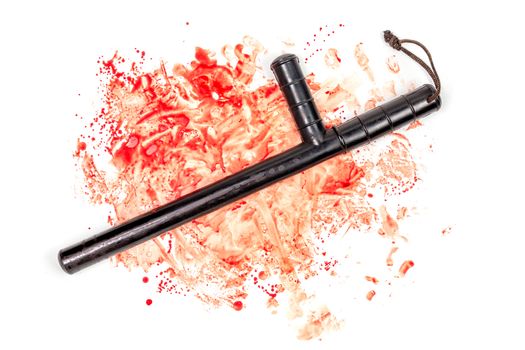 Bloody russian police rubber tonfa baton in blood spatter isolated on white background in top-down flat lay perspective. Natural human blood used.