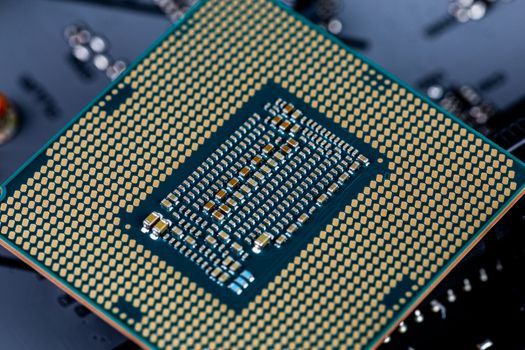 back side of modern lga 1151v2 central processor unit - closeup with selective fcus and blur.