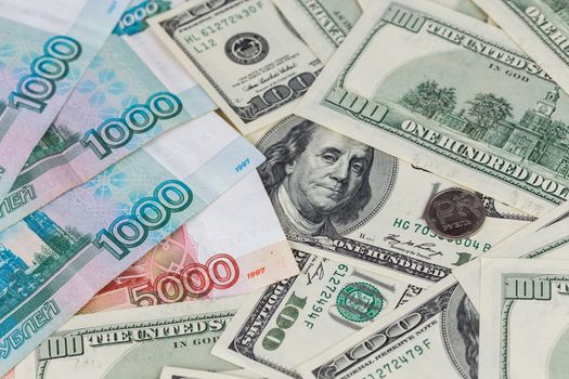 us dollars and russian rubles close-up background with selective focus.