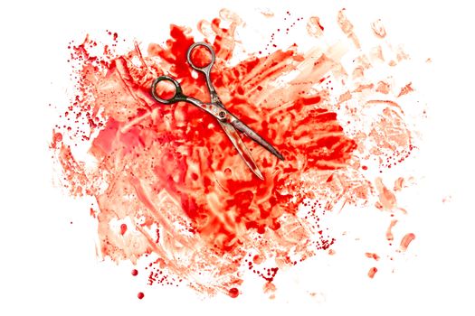 old soviet scissors on human blood splatter isolated on white background in flat lay top-down perspective.
