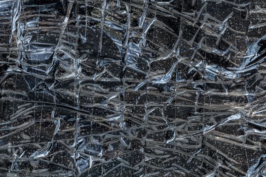 black polyethilene film enforced by sticky tape flat smuggle package texture and background