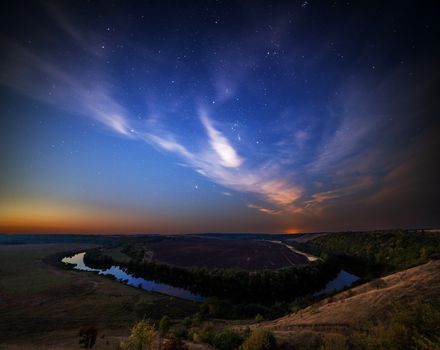 summer riverside landscape at starry night with purple clouds.