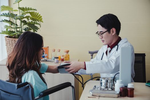 Doctor is measuring the pressure to check the health of female patients in the hospital.