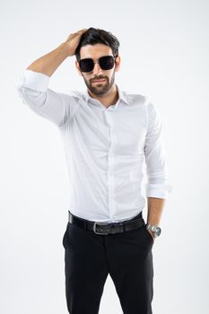 Portrait handsome Caucasian man wearing black glasses, sunglasses, standing hair style and looking at the camera shot in a studio with setting the light on white background.