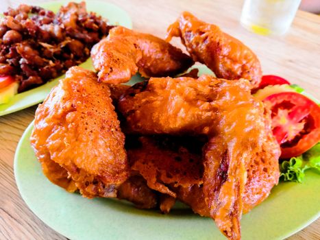 Crispy fried chicken wings on a plate