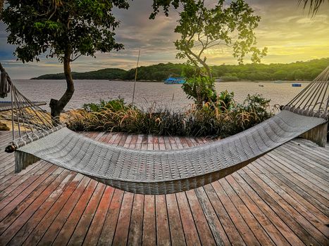 Hammocks tied to trees and views on the beach terrace