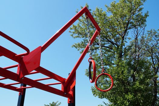 outdoor exercise machine with shoulder and arm rings close-up
