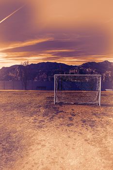 Deserted sports field on the shores of Lake Garda in Italy at dawn in a contemporary style.