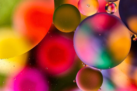 colorful surface with abstract round shapes structure of oil in water.