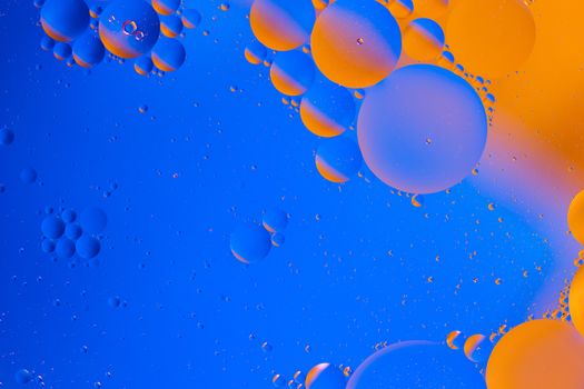 oil in water abstract macro bubbles gradient blue-orange space background