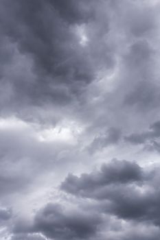 gray incoming storm clouds closeup backdrop, captured with telephoto lens